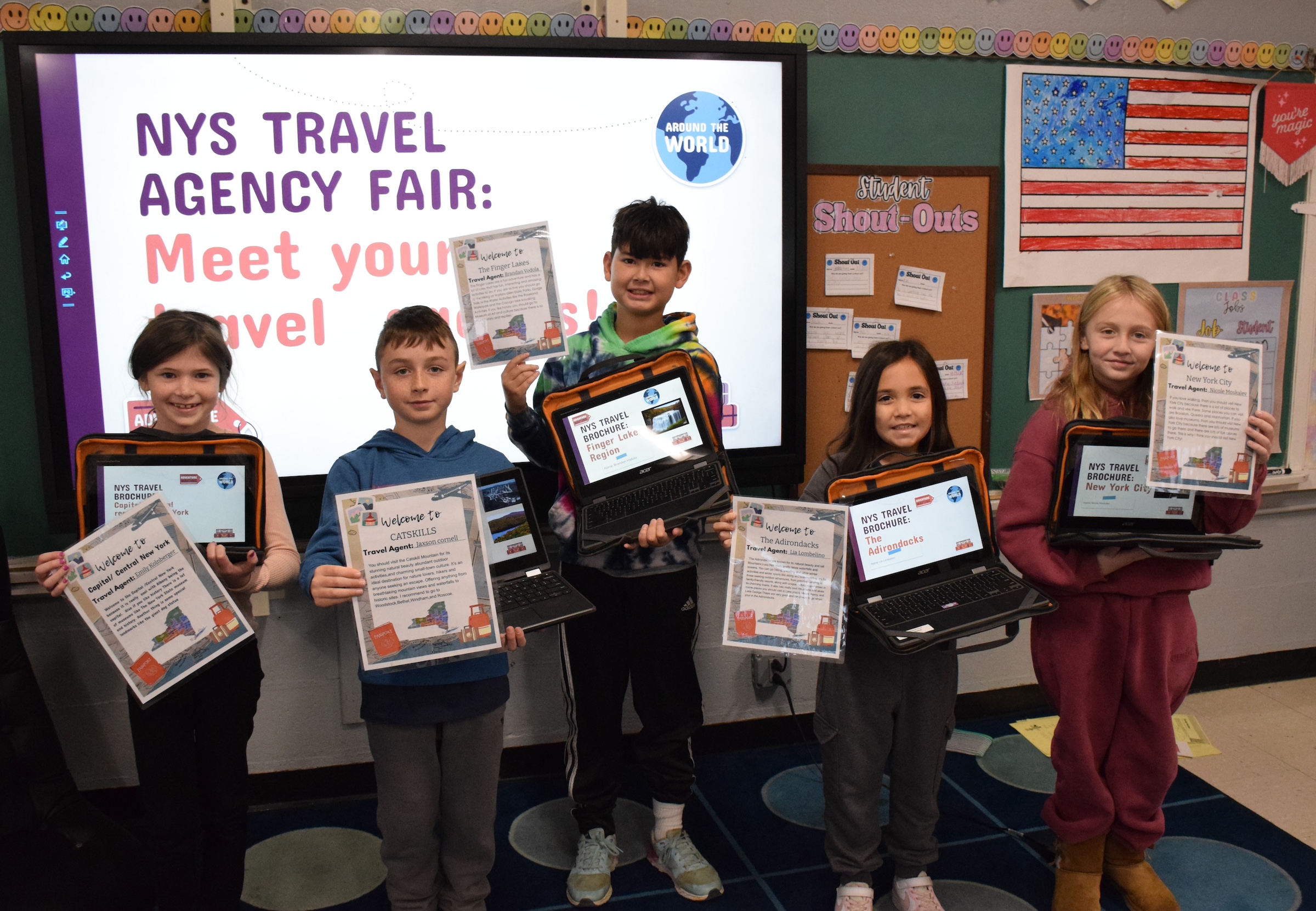 students standing in front of colorful art on the wall